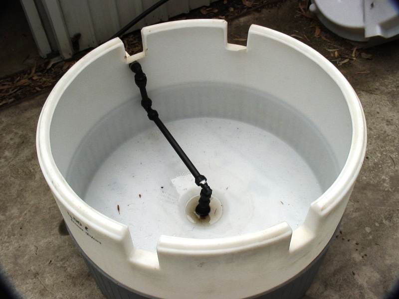 Barrel with top cut out and pipes fitted.JPG