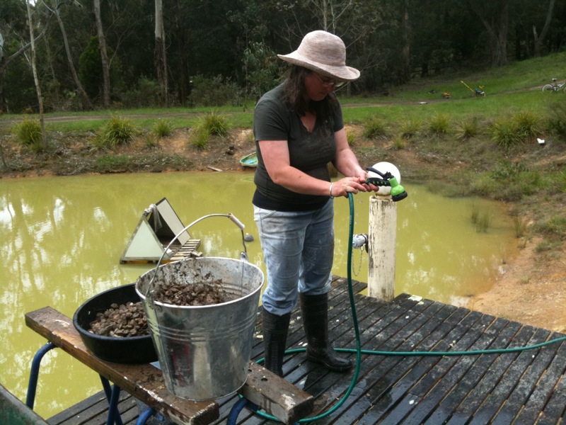 Kathy washing crushed brick 2.jpg
