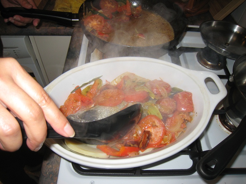 Placing sauce on fish.jpg