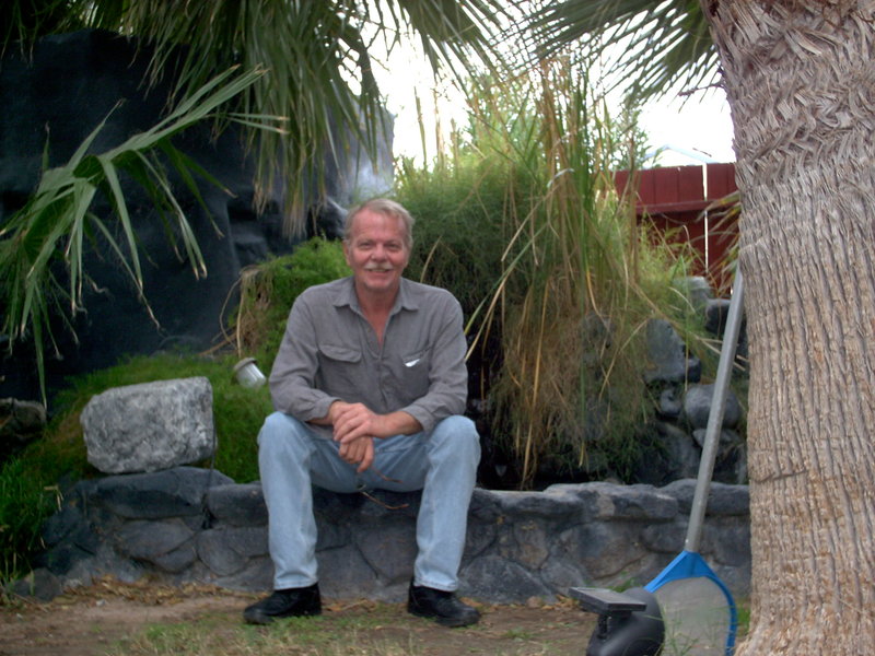 rsz_mike_seated_on_fountain resized.jpg