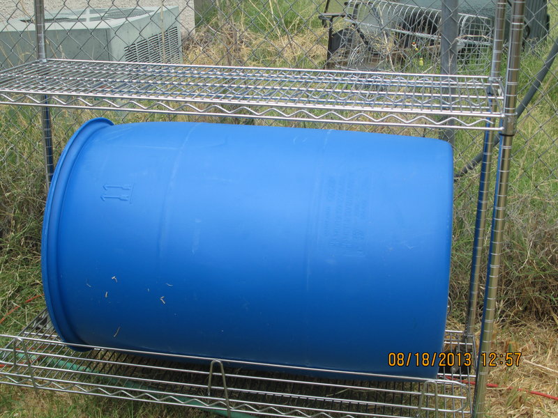 Empty barrel in stainless steel rack.jpg