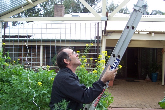 Eddy installingcustom made hooks for bobbins.jpg