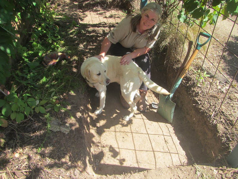 Jo resting with Lugi in the sump tank hole.jpg