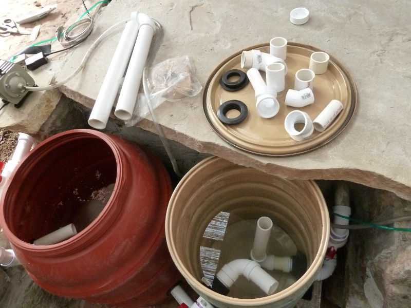 Sunday-plumbing-madness-pond-water-flowing-through-barrels.JPG