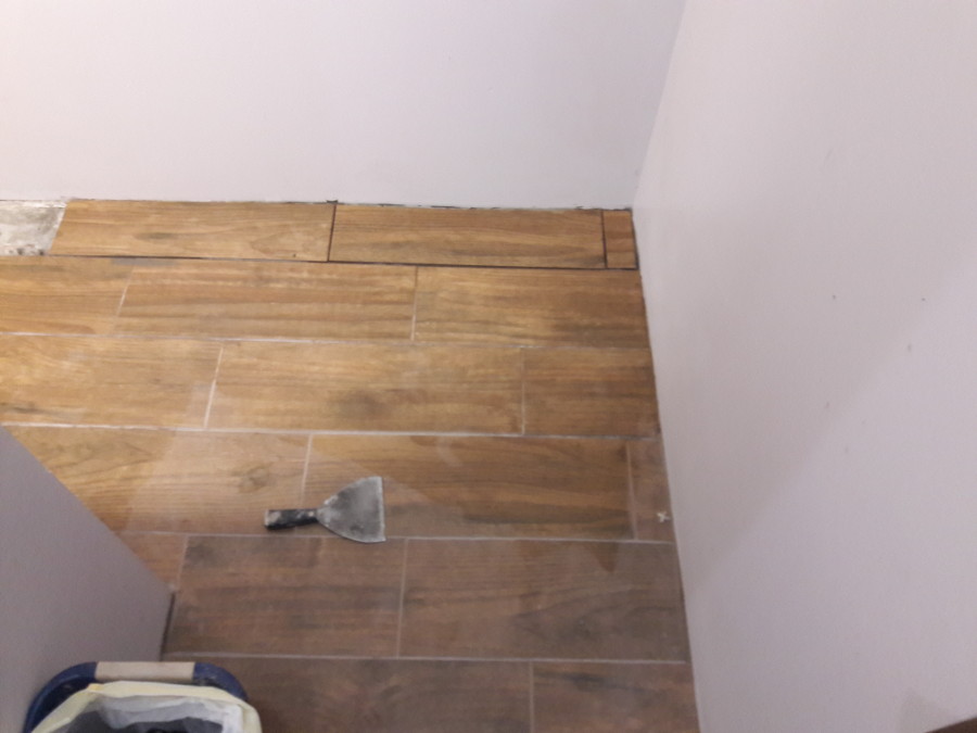 Jan-19-2018-working-tile-in-powder-room-south-side-hall.jpg