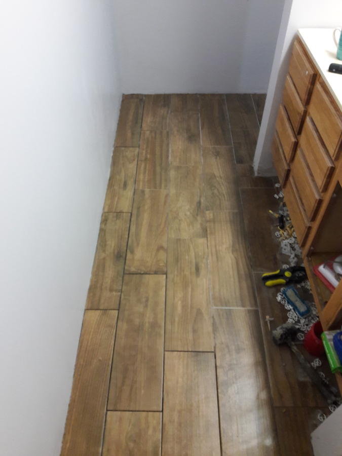 Jan-20-2018-Almost finished-tiling-in-Powder-room.jpg