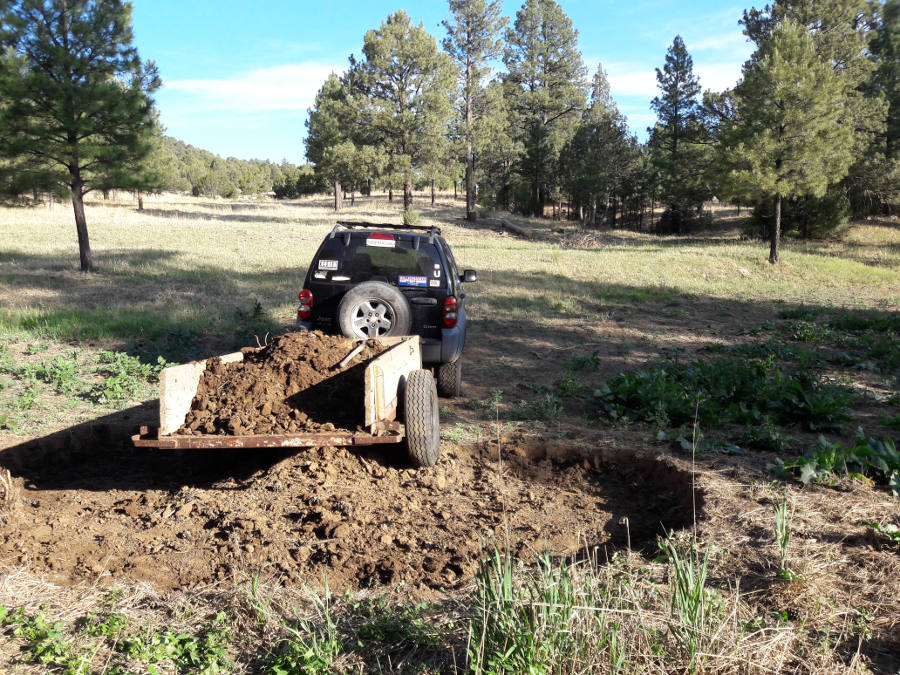 Topsoil-grab-dry-pond-to-fill-excavation-at-house-Jeep-loaded-6-14-18.jpg
